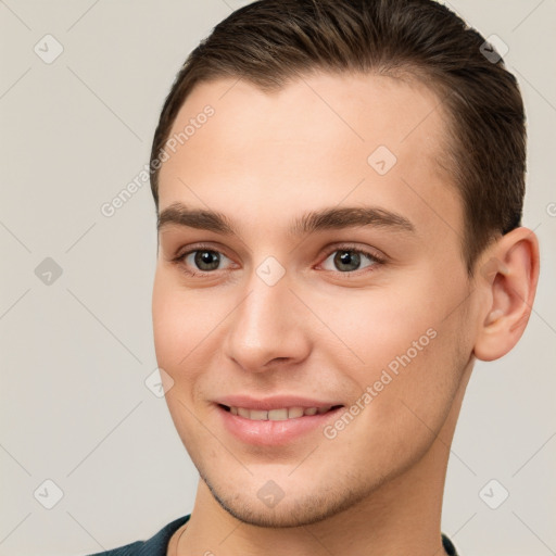 Joyful white young-adult male with short  brown hair and brown eyes