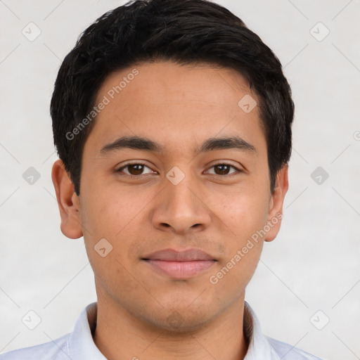 Joyful latino young-adult male with short  brown hair and brown eyes