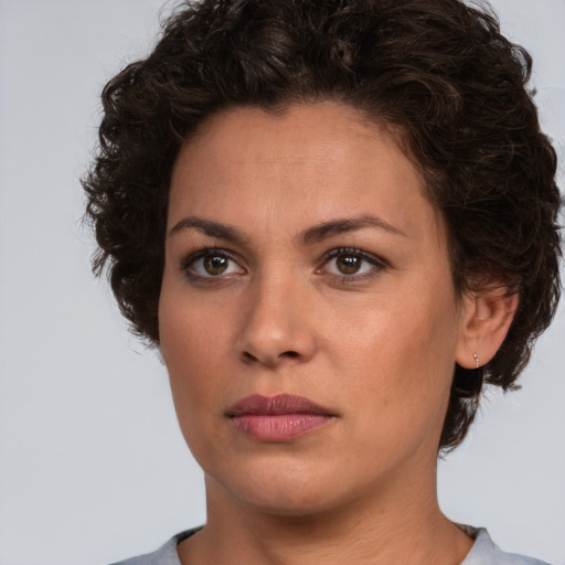 Neutral white young-adult female with short  brown hair and brown eyes