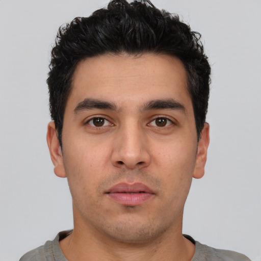 Neutral white young-adult male with short  black hair and brown eyes
