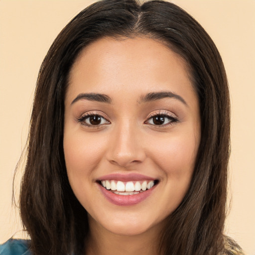 Joyful white young-adult female with long  brown hair and brown eyes