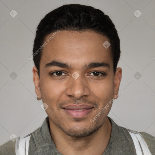 Joyful latino young-adult male with short  black hair and brown eyes