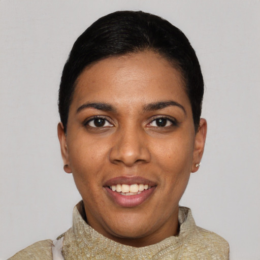 Joyful black young-adult female with short  black hair and brown eyes
