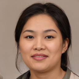 Joyful white young-adult female with medium  brown hair and brown eyes