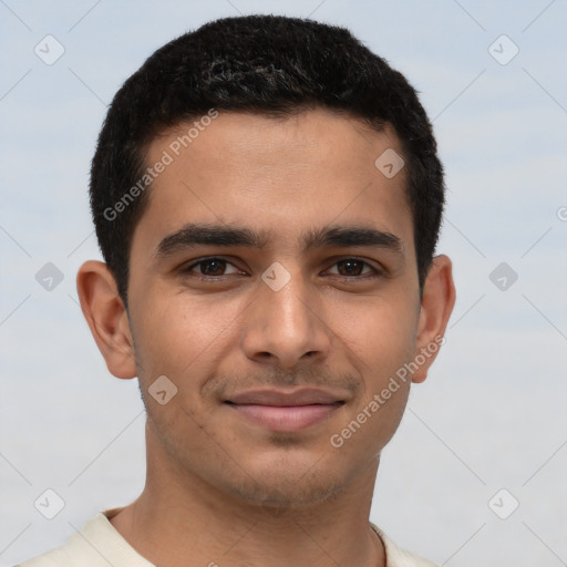 Joyful latino young-adult male with short  brown hair and brown eyes