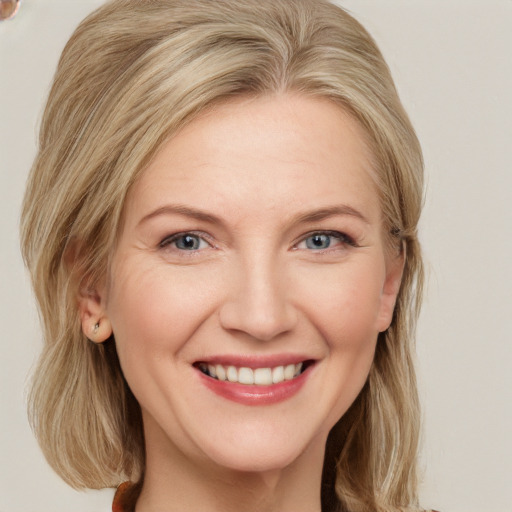 Joyful white young-adult female with medium  blond hair and blue eyes