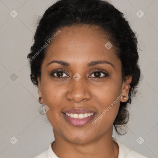 Joyful black young-adult female with medium  black hair and brown eyes