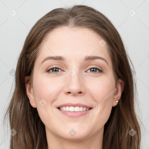 Joyful white young-adult female with long  brown hair and grey eyes