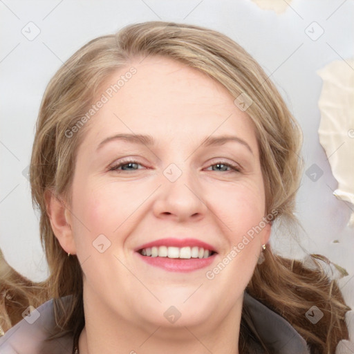 Joyful white adult female with medium  brown hair and blue eyes