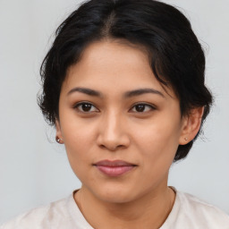 Joyful latino young-adult female with medium  brown hair and brown eyes