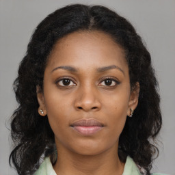 Neutral black young-adult female with long  brown hair and brown eyes