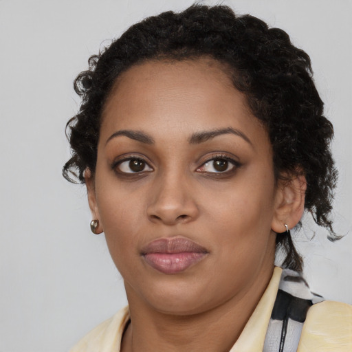 Neutral black young-adult female with long  brown hair and brown eyes