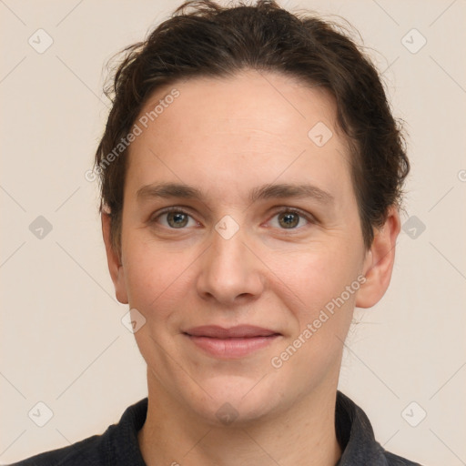 Joyful white adult male with short  brown hair and grey eyes