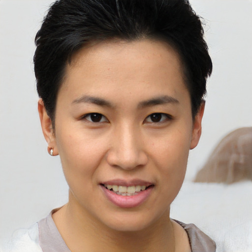 Joyful white young-adult female with short  brown hair and brown eyes