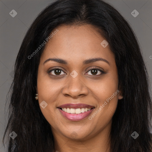 Joyful black young-adult female with long  brown hair and brown eyes