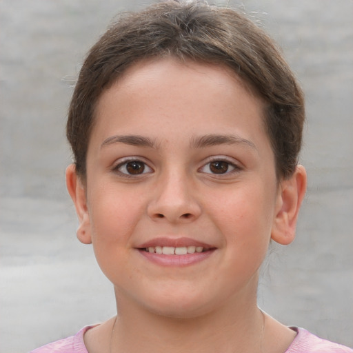 Joyful white child female with short  brown hair and brown eyes