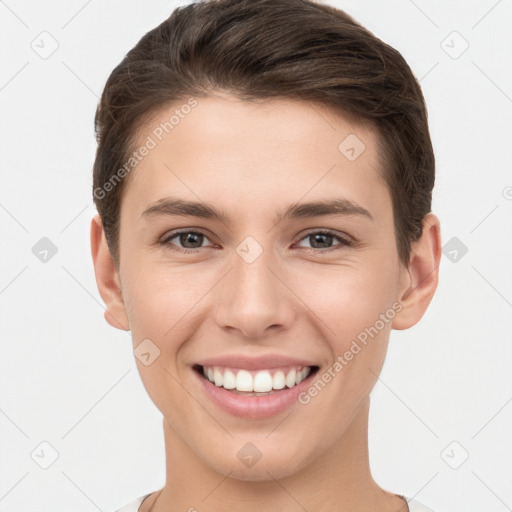 Joyful white young-adult female with short  brown hair and brown eyes