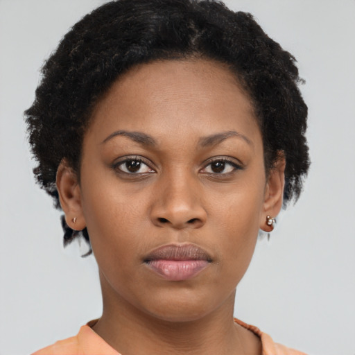 Neutral black young-adult female with short  brown hair and brown eyes