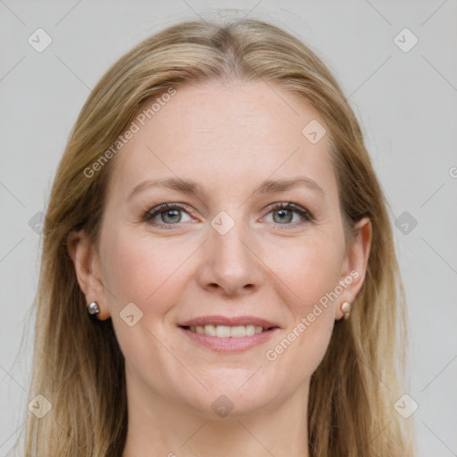 Joyful white adult female with long  brown hair and grey eyes