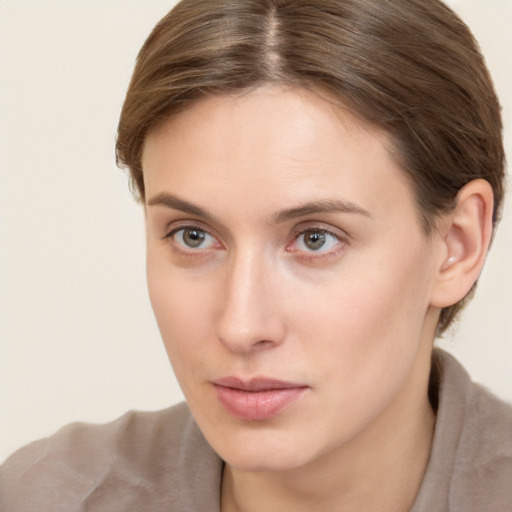 Neutral white young-adult female with short  brown hair and brown eyes