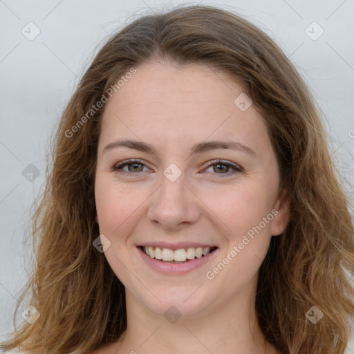 Joyful white young-adult female with long  brown hair and green eyes