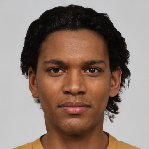 Neutral black young-adult male with short  black hair and brown eyes