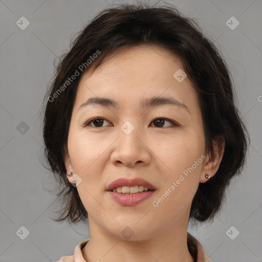 Joyful asian young-adult female with medium  brown hair and brown eyes