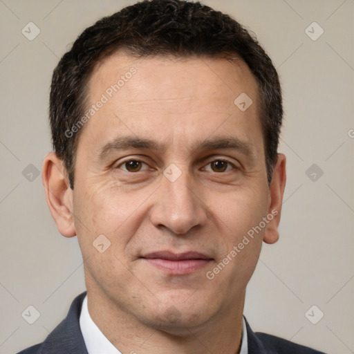 Joyful white adult male with short  brown hair and brown eyes