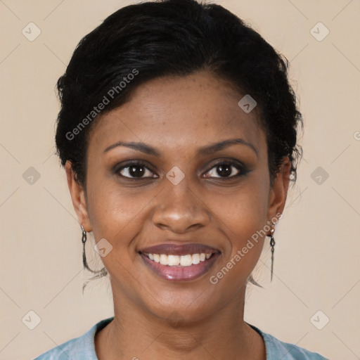 Joyful black young-adult female with short  black hair and brown eyes