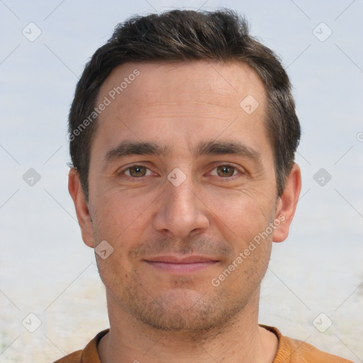 Joyful white adult male with short  brown hair and brown eyes