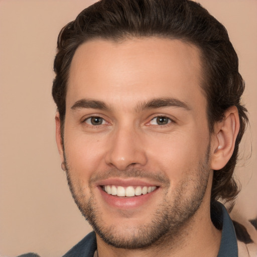 Joyful white young-adult male with short  brown hair and brown eyes