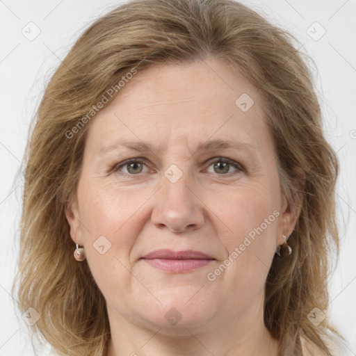 Joyful white adult female with medium  brown hair and grey eyes