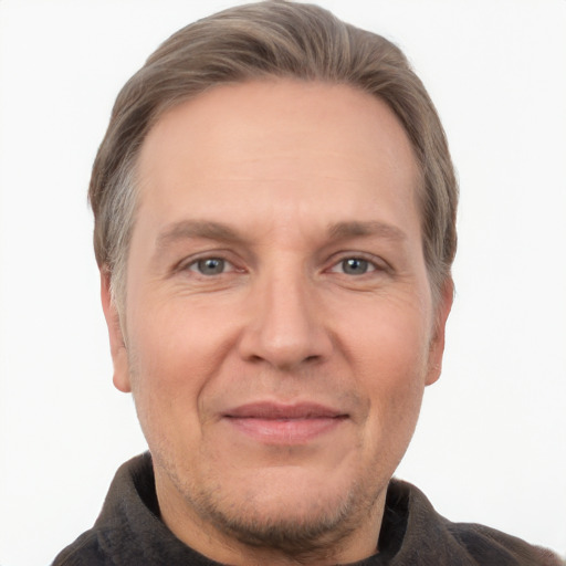 Joyful white adult male with short  brown hair and grey eyes