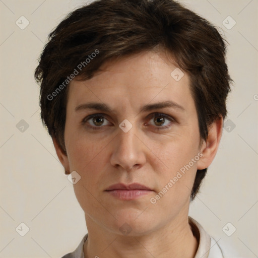 Joyful white adult female with short  brown hair and brown eyes