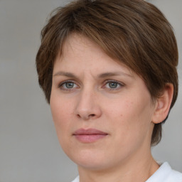 Joyful white adult female with short  brown hair and brown eyes