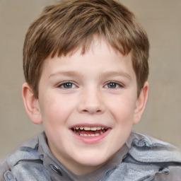 Joyful white child male with short  brown hair and brown eyes