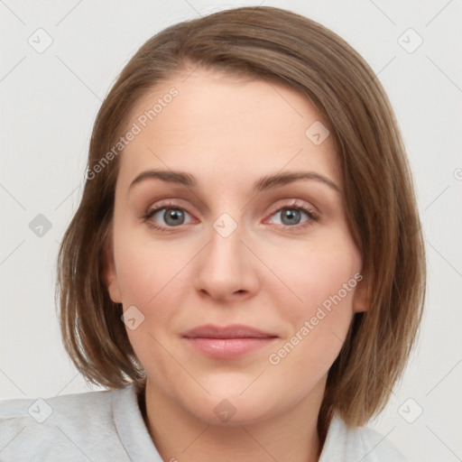 Joyful white young-adult female with medium  brown hair and blue eyes