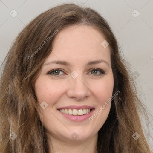 Joyful white young-adult female with long  brown hair and green eyes