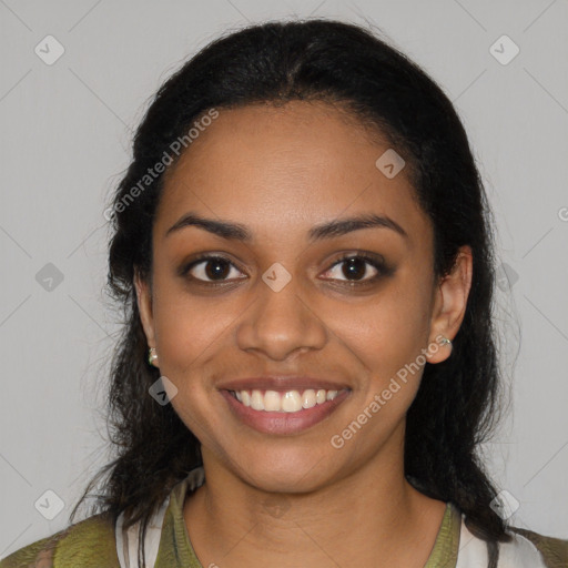 Joyful black young-adult female with long  black hair and brown eyes