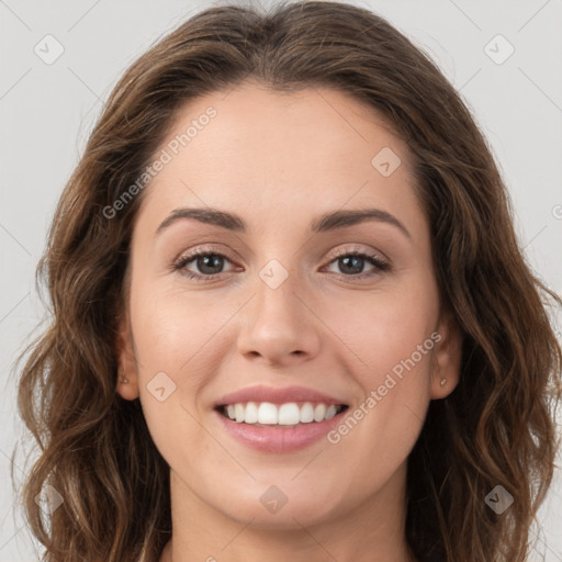 Joyful white young-adult female with long  brown hair and green eyes