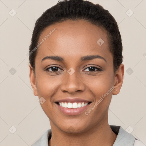 Joyful latino young-adult female with short  brown hair and brown eyes