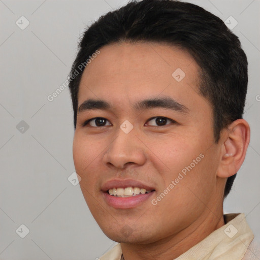 Joyful asian young-adult male with short  black hair and brown eyes