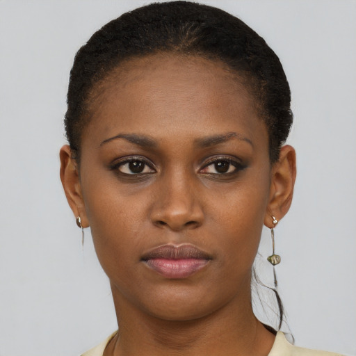Neutral black young-adult female with short  brown hair and brown eyes