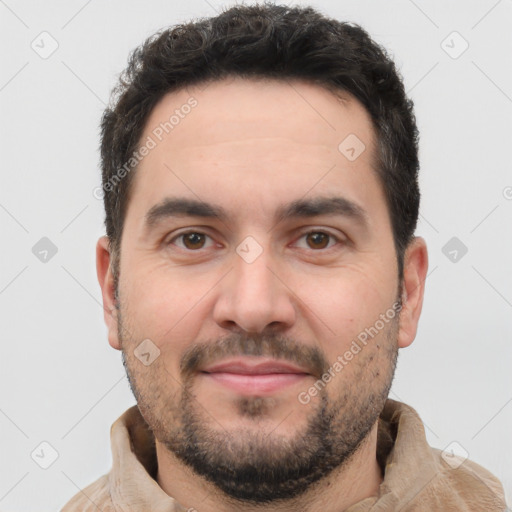 Joyful white young-adult male with short  black hair and brown eyes