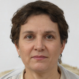 Joyful white adult female with short  brown hair and brown eyes