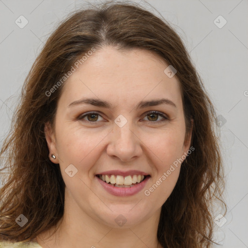 Joyful white young-adult female with long  brown hair and green eyes