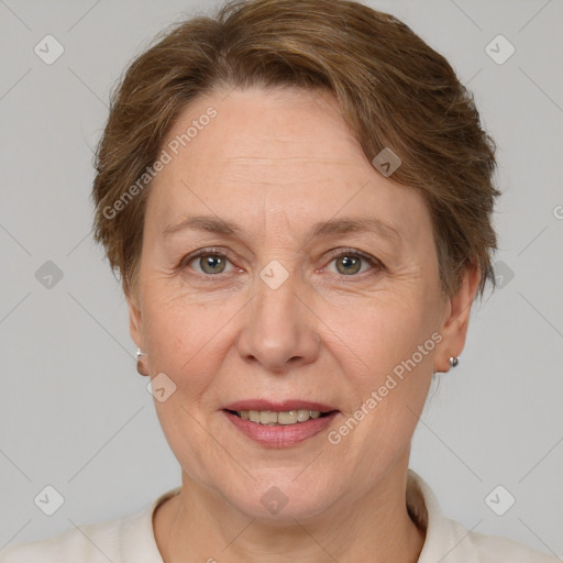 Joyful white adult female with short  brown hair and grey eyes