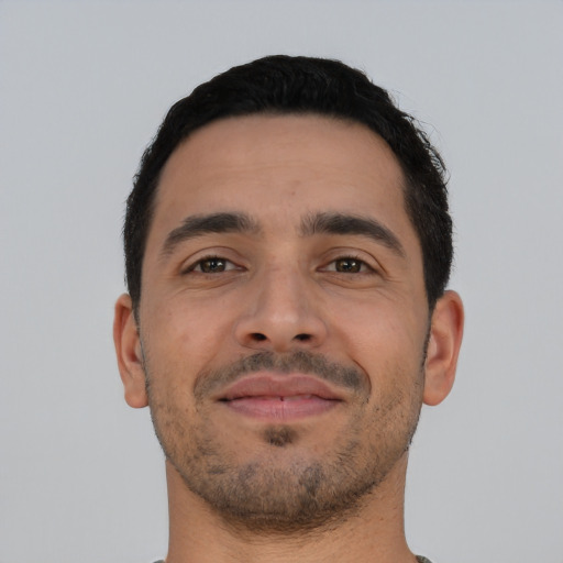 Neutral latino young-adult male with short  black hair and brown eyes