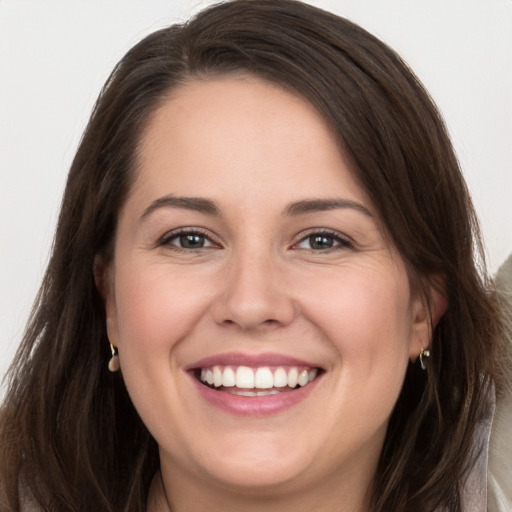 Joyful white young-adult female with long  brown hair and grey eyes