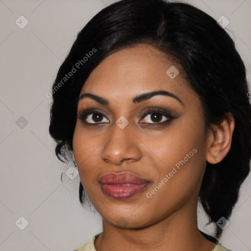 Joyful black young-adult female with medium  black hair and brown eyes